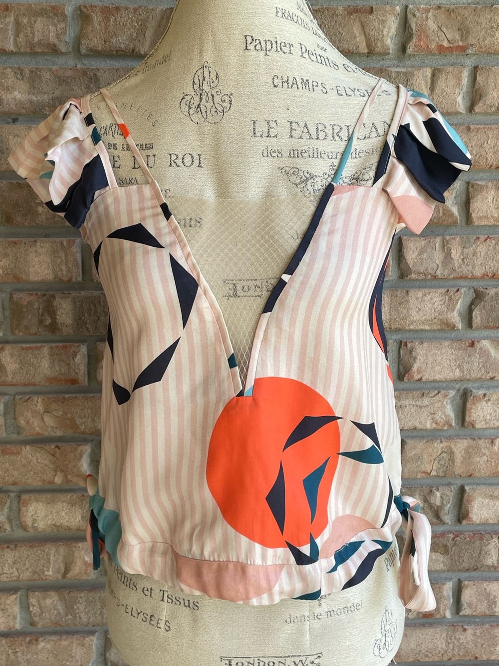 Katharine Kidd Light Pink Stripe Top with Coral Print and Flutter Sleeve.